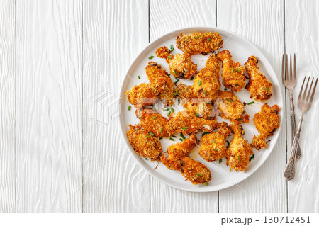 Panko breaded oven baked chicken wings on plate Panko breaded oven baked chicken wings on plate 130712451