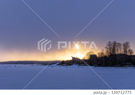 Natural winter landscape photography featuring bare trees silhouettes 130712775