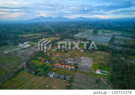 Aerial view of rice plantations and a hill village from a drone. Rice terraces on the island of Bali. 130713378