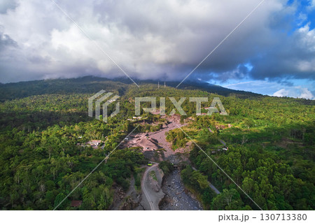A beautiful valley under an active volcano. An old river made of ash and lava where minerals are mined. 130713380