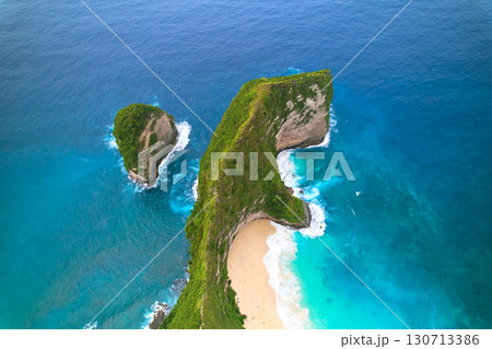 Cinematic aerial landscape shots of the beautiful island dinosaur of Nusa Penida. Huge cliffs by the shoreline and hidden dream beaches with clear water. 130713386