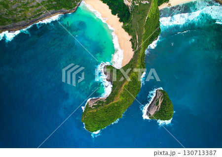 Cinematic aerial landscape shots of the beautiful island dinosaur of Nusa Penida. Huge cliffs by the shoreline and hidden dream beaches with clear water. 130713387