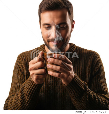 Man Holding Steaming Mug in Brown Sweater Isolated on White Backdrop 130714774