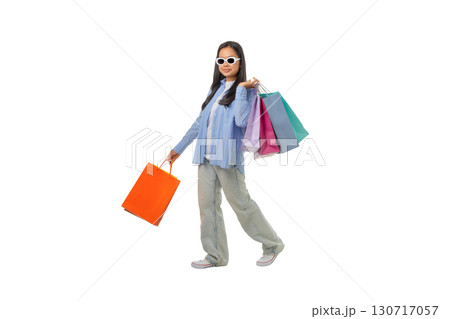 Girl smiles with shopping bags, isolated on white, PNG 130717057