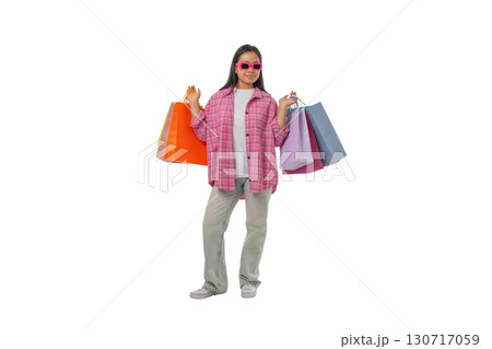 Woman with colorful shopping bags, isolated on white, PNG 130717059