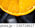 Close Up of Juicy Orange Slice with Vibrant Citrus Texture 130718627