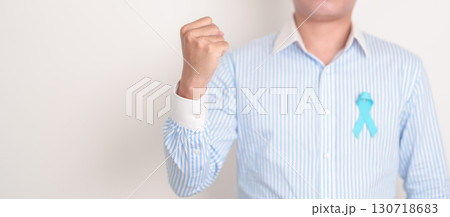 man with blue Ribbon for concept of blue November, November Prostate Cancer Awareness month, World Diabetes day , Men Health month, International men, Father day. Healthcare and world cancer day man with blue Ribbon for concept of blue November, November Prostate Cancer Awareness month, World Diabetes day , Men Health month, International men, Father day. Healthcare and world cancer day 130718683