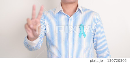 Man with blue Ribbon for concept of blue November, November Prostate Cancer Awareness month, World Diabetes day , Men Health month, International men, Father day. Healthcare and world cancer day Man with blue Ribbon for concept of blue November, November Prostate Cancer Awareness month, World Diabetes day , Men Health month, International men, Father day. Healthcare and world cancer day 130720303