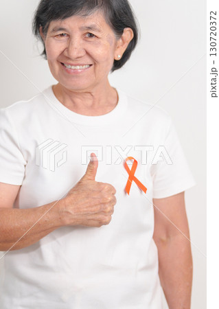 Elderly with Orange Ribbon for September Leukemia, March Kidney cancer day, Multiple Sclerosis, November Complex Regional Pain Syndrome, CRPS, COPD, Chronic Obstructive Pulmonary disease concepts 130720372