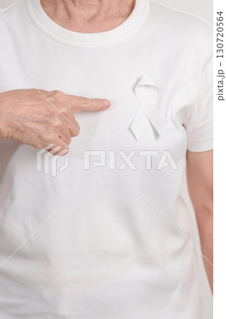 Elderly with White ribbon for concept November Lung Cancer Awareness month, Stop Violence Against Women, Adoption, May Retinoblastoma, Action for Women Health, March Remembrance, October Osteoporosis Elderly with White ribbon for concept November Lung Cancer Awareness month, Stop Violence Against Women, Adoption, May Retinoblastoma, Action for Women Health, March Remembrance, October Osteoporosis 130720564