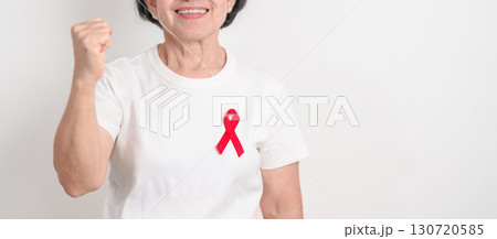 Elderly with Red Ribbon for December World Aids Day, MADD, October Red ribbon week, February Heart month, Marfan Syndrome, May Stroke awareness, March world TB Tuberculosis day and April Dare day 130720585