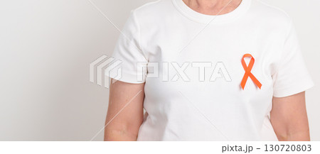 Elderly with Orange Ribbon for Leukemia, Kidney cancer day, Multiple Sclerosis, Self Injury Awareness month, Hunger action, Complex Regional Pain Syndrome, Gun Violence, Agent Orange, Work Zone safety 130720803