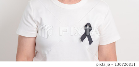 Elderly with Black ribbon for May Melanoma and skin cancer Awareness month, October Vaccine injury awareness month, Mourning Remembrance, March Sleep awareness week, Gang Prevention and Anti Violence 130720811