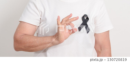 Elderly with Black ribbon for May Melanoma and skin cancer Awareness month, October Vaccine injury awareness month, Mourning Remembrance, March Sleep awareness week, Gang Prevention and Anti Violence 130720819