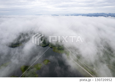 Landscape of Morning Mist with Mountain Layer. mountain ridge and clouds in rural jungle bush forest 130720952
