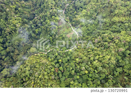 Landscape of Morning Mist with Mountain Layer. mountain ridge and clouds in rural jungle bush forest 130720991