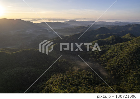 Landscape of Morning Mist with Mountain Layer. mountain ridge and clouds in rural jungle bush forest Landscape of Morning Mist with Mountain Layer. mountain ridge and clouds in rural jungle bush forest 130721006