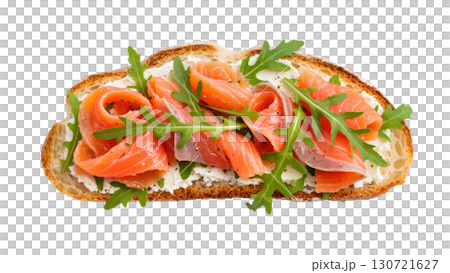 Open sandwich with smoked salmon, cream cheese, and arugula on toasted bread. Fresh gourmet appetizer. Isolated on transparent background. Open sandwich with smoked salmon, cream cheese, and arugula on toasted bread. Fresh gourmet appetizer. Isolated on transparent background. 130721627