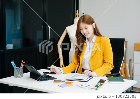 Young woman running online store Startup small business SME, using smartphone or tablet taking receive and checking Young woman running online store Startup small business SME, using smartphone or tablet taking receive and checking 130722303