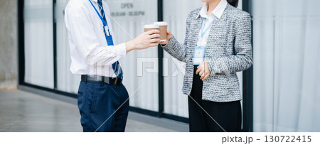 Business partnership handshake concept.Photo two coworkers handshaking process. Business partnership handshake concept.Photo two coworkers handshaking process. 130722415
