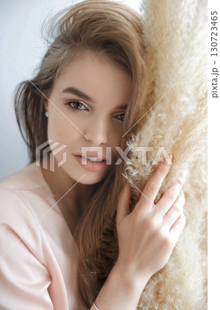 Beauty smiling happy model with natural make up and long eyelashes smiles in cafe. 130723465