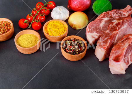 Ingredients including raw meats, vegetables, various spices arranged for preparing barbecue. Ingredients including raw meats, vegetables, various spices arranged for preparing barbecue. 130723937