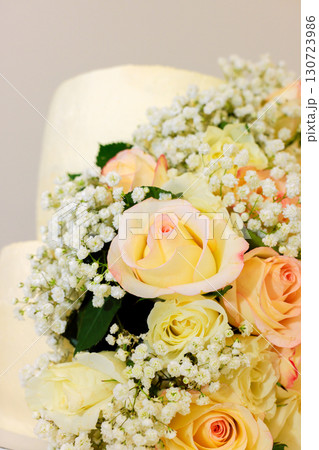 Stunning arrangement features soft pastel roses baby breath, perfect for celebrations or special events. 130723986