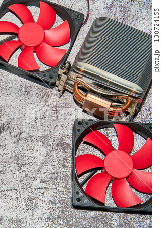 From above of vintage red CPU cooler also called PC cooling fan placed on surface From above of vintage red CPU cooler also called PC cooling fan placed on surface 130724155