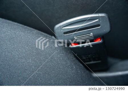 Artificial seat belt plug.Violation of traffic rules. Irresponsible driving and behavior concept Artificial seat belt plug.Violation of traffic rules. Irresponsible driving and behavior concept 130724990