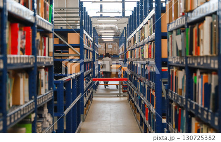 logistic warehouse. packing line in a logistics warehouse. conveyor belt in a modern production line logistic warehouse. packing line in a logistics warehouse. conveyor belt in a modern production line 130725382