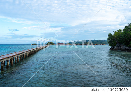 Wooden jetty to Bajo village, Pulau Papan, Sulawesi, Indonesia Wooden jetty to Bajo village, Pulau Papan, Sulawesi, Indonesia 130725689