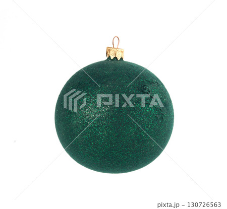 A single, glittery green Christmas tree ornament isolated on a white background, perfect for holiday-themed designs. 130726563