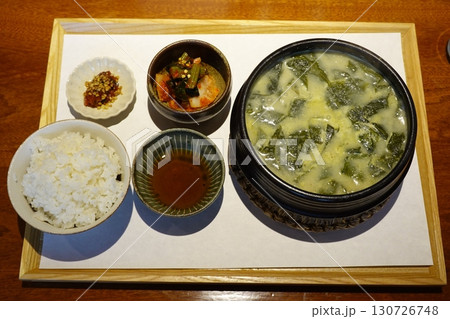 A vibrant spread of Korean food on the table, featuring various banchan (side dishes) like kimchi, pickled vegetables, and seasoned greens. Perfect for food photography, showcasing traditional Korean. 130726748