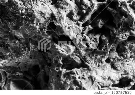 A close-up shot of the stone shows its relief 130727656