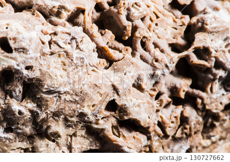 The rough stone surface is covered with microcracks The rough stone surface is covered with microcracks 130727662
