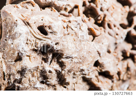 The rough stone surface is covered with microcracks The rough stone surface is covered with microcracks 130727663