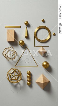 Geometric Design Study Flatlay with Brass, Wood, and Paper Architectural Models Arranged on Gray Background 130728575