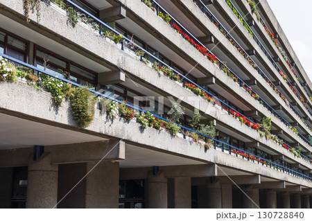 Barbican Estate, London, UK - Brutalist Concrete Terraces with Colorful Balconies and Plants 130728840