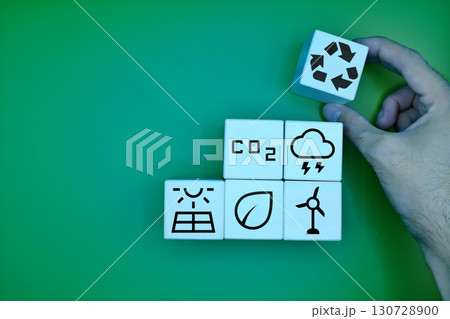 Wooden blocks symbolizing renewable energy and sustainability concepts 130728900