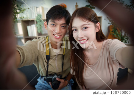 Travel Memories. Young couple taking a selfie together with a camera. 130730000