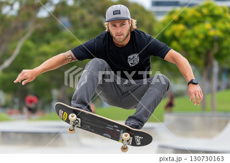 Skateboarder performing trick in skate park, extreme sport and urban lifestyle 130730163