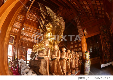 Golden sitting Buddha statue and there is a serpent covering the back in Buddhist Thai Church at Wat Den Sali Si Mueang Kaen temple. Located at Chiang Mai city in Thailand. Golden sitting Buddha statue and there is a serpent covering the back in Buddhist Thai Church at Wat Den Sali Si Mueang Kaen temple. Located at Chiang Mai city in Thailand. 130730657