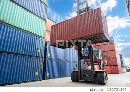 Crane lifting handling up with container box at dockyard, Container loading cargo freight in import and export business logistic industry. Crane lifting handling up with container box at dockyard, Container loading cargo freight in import and export business logistic industry. 130731363