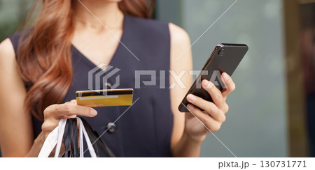 Shopping and Payment. Woman using smartphone for online shopping with credit card. Shopping and Payment. Woman using smartphone for online shopping with credit card. 130731771