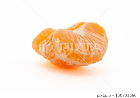 A slice of orange mandarin with a white background A slice of orange mandarin with a white background 130733666