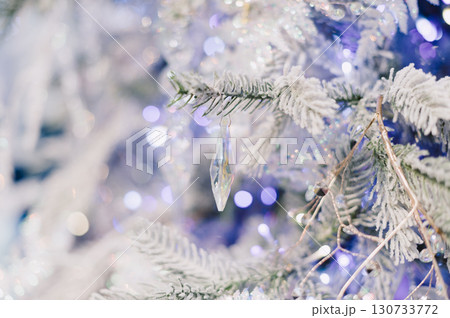 A tree with a crystal ornament hanging from it 130733772