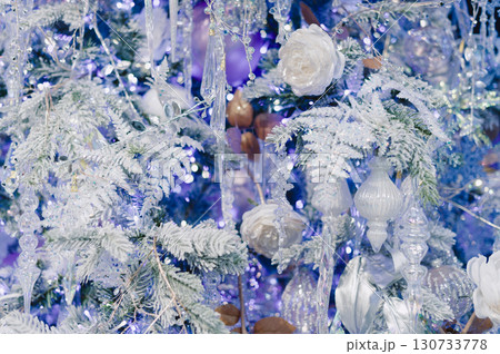 A white flower is in the center of a blue background A white flower is in the center of a blue background 130733778