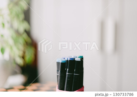 A bunch of pens are sitting on a table A bunch of pens are sitting on a table 130733786