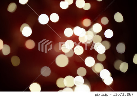 A blurry image of a red background with many white circles 130733867