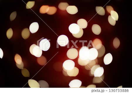 A blurry image of a red background with many white circles 130733886